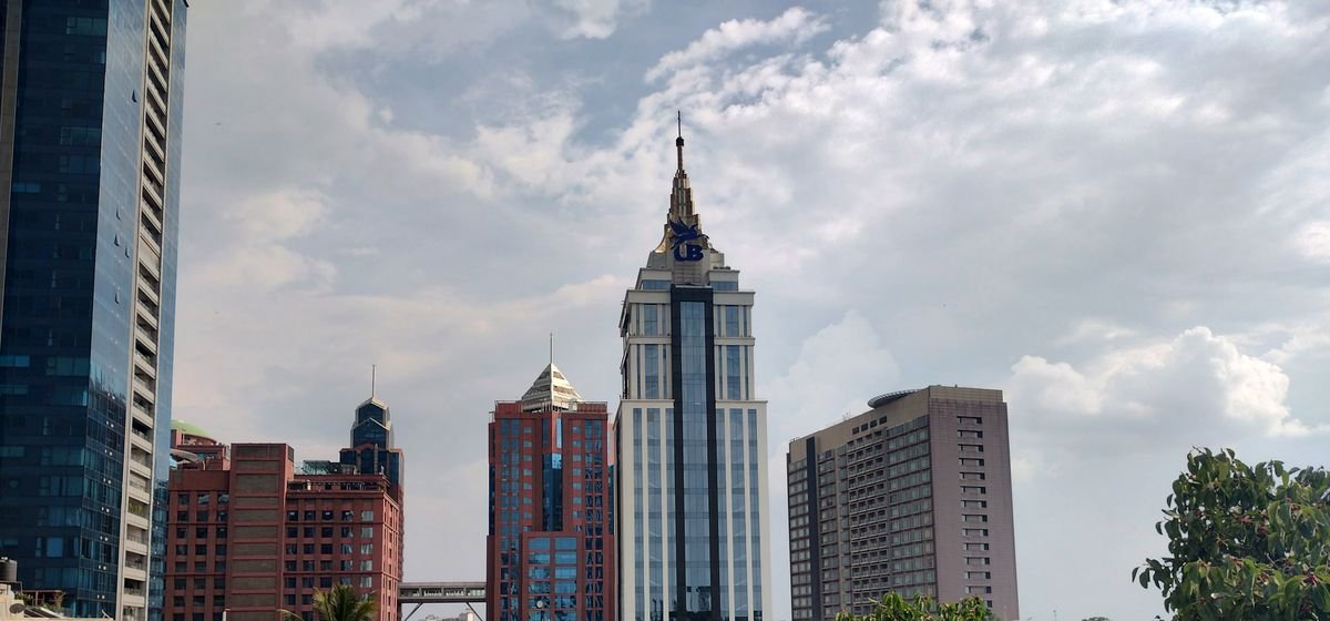 Corporate towers of the UB City business district in Bengaluru, representative of IMC's Indian advisory presence